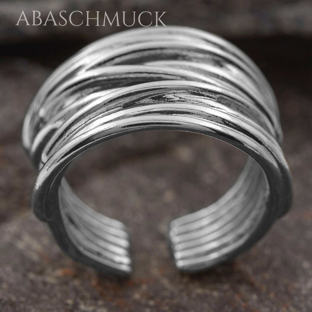 Offener Silberring mit mehreren geschwungenen Linien, seitliche Ansicht.